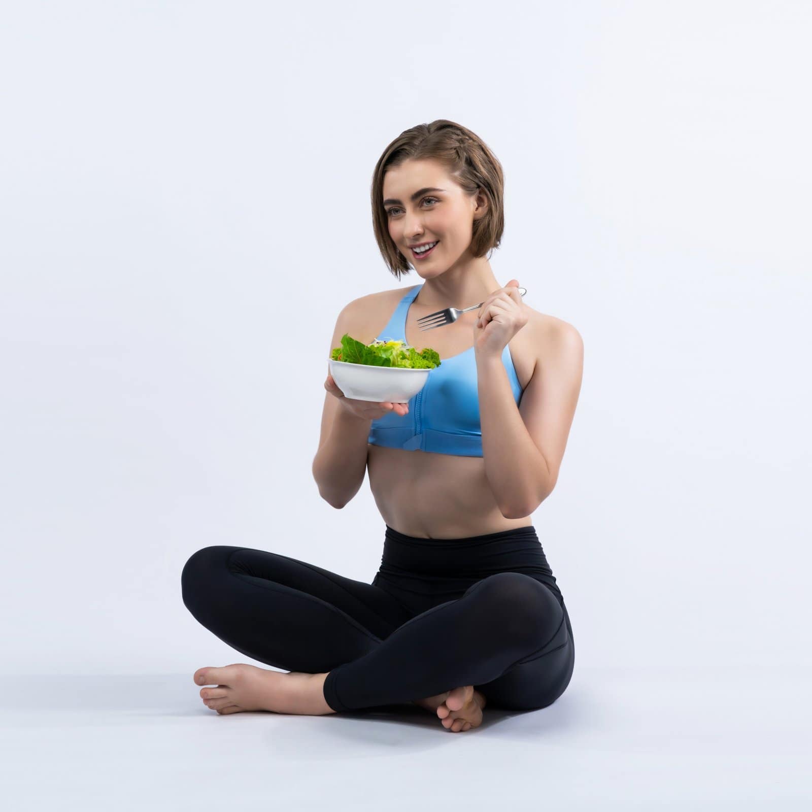 Full body length gaiety shot athletic and sporty young woman with healthy vegan food in standing posture on isolated background. Healthy active and body care by vegetarian lifestyle.